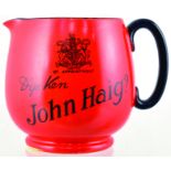 HAIGS PUB JUG. 4.25ins tall, external red glazed, black handled jug for JOHN HAIG? in black