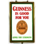 GUINNESS METAL FRAMED ENAMEL SIGN. 20.25 x 12ins. GUINNESS/ IS GOOD/ FOR YOU in red lettering at the