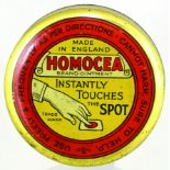 HOMOCEA OINTMENT TIN. 2.25ins diam, predominently gold coloured tin with hand pict. & usage