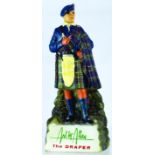 MCALLAN THE DRAPER BACK BAR FIGURE. 12ins tall, rubberoid brewery figure of kilted gent stood on