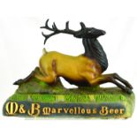 M & B MARVELLOUS BEER LIGHT UP BACK BAR FIGURE. 13ins wide, rubberoid figure of reclining stag on