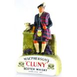 MACPHERSONS CLUNY SCOTCH WHISKY BACK BAR FIGURE. 9.25ins tall. Rubberoid kilted gent stood againt