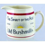 OLD BUSHMILLS PUB JUG. 4.5ins tall, off white, handled jug for THE SPIRIT OF THE AGE/ ESTD 1784/ OLD