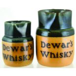 DEWARS WHISKY WATER JUGS DUO. Tallest 5.5ins, t.t. handled water jugs (smallest handle missing).