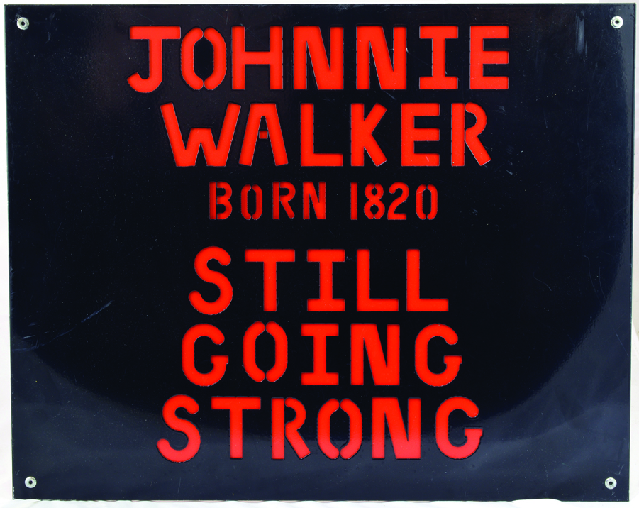 JOHNNIE WALKER METAL SIGN. 20 x 16ins, 2 sheets of metal joined together, one black, one red. The