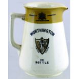 WORTHINGTON PUB JUG. 4.75ins tall, off white glaze, tan top rim with coat of arms in black.