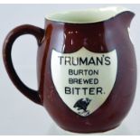 TRUMANS ALE PUB JUG. 4.5ins tall, brown handled jug for TRUMANS/ BURTON/ BREWED/ BITTER in white