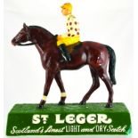 ST LEGER SCOTCH BACK BAR FIGURE. 12ins tall, plaster advertising figure of horse & jockey wearing