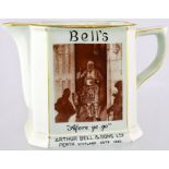 PERTH BELLS PUB JUG. 5ins tall, off white glaze & gold highlights. Sepia pictorial image of a kilted