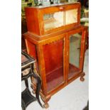 A 20th century walnut cocktail cabinet.