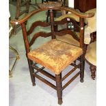 An 18th century oak ladder back corner chair.