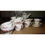 A Shelley china floral decorated part tea set and a Wedgwood floral decorated tea set.