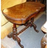 A Victorian walnut serpentine fold over card table.