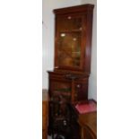 An Edwardian mahogany and inlaid two tier corner cabinet.