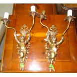 A pair of 20th century wall sconces, depicting putti, (2).