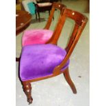 A set of four Victorian oak buckle back dining chairs, each with different coloured upholstery (4).