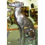 A reproduction bronze of a seated greyhound.