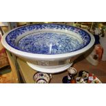 A 19th century blue and white transfer printed conical ceramic lavatory bowl,