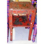 A 19th century red and black lacquer Chinese two tier side table, 46cm wide.