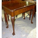A 19th century mahogany fold over card table on cabriole supports.