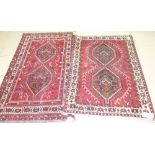 Two Shiraz rugs; one 145cm x 107cm, the other 166cm x 105cm (2).