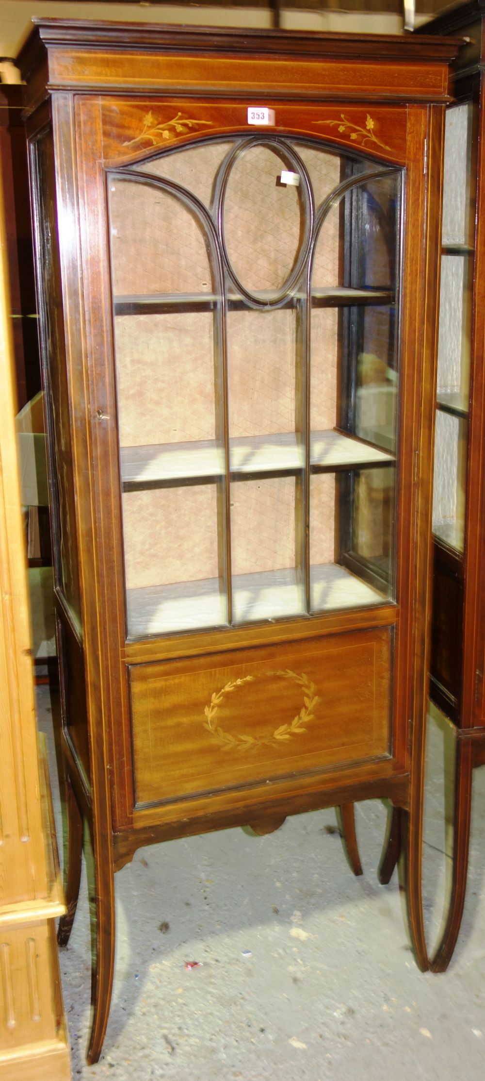 An Edwardian mahogany glazed display cabinet.