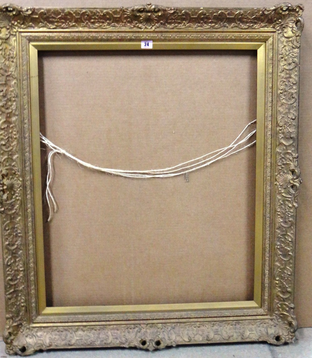 A 20th century gilt plaster frame, aperture 77cm x 64cm.