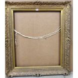 A 20th century gilt plaster frame, aperture 77cm x 64cm.