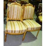 A pair of 19th century gilt framed upholstered side chairs, (2).