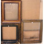 A group of three 19th and early 20th century gilt plaster frames, the largest aperture 67cm x 56cm.