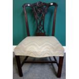 A George III carved mahogany single chair, with serpentine seat, on channelled square supports,