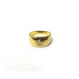 A gold and diamond set single stone ring, collet with a circular cut diamond, detailed 14,