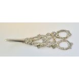 A pair of silver grape scissors, the handles cast and pierced with fruiting vine,
