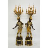 A pair of 20th century carved wood and gesso parcel gilt nine light candelabra,