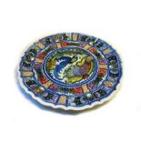 A modern Greek pottery matched part service, hand painted with exotic birds amongst foliage,