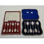 A set of six silver teaspoons, decorated with scallop shell shaped bowls and having spiral stems,