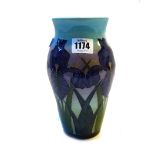 A Dennis China Works vase by Sally Tuffin, circa 2000, decorated with purple iris against a blue,