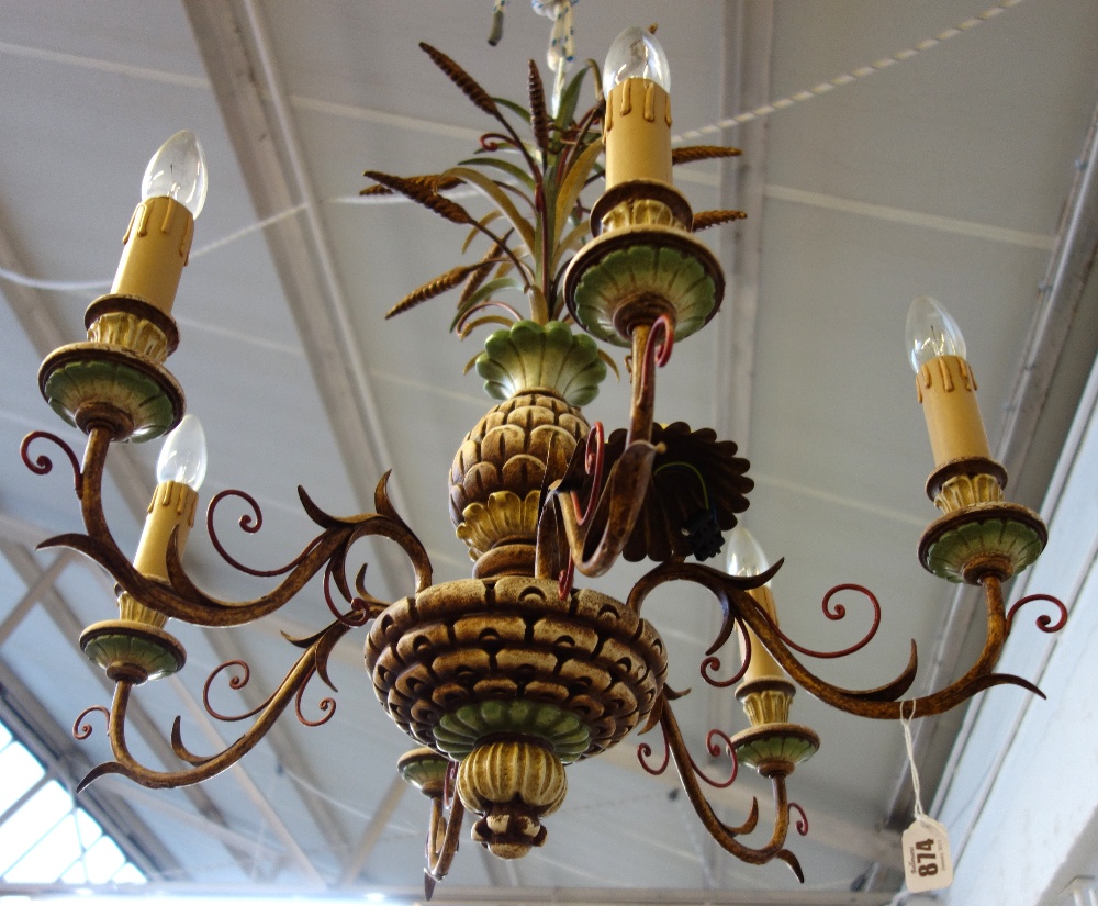 A modern polychrome painted six branch chandelier, the carved wooden body of 'pineapple' form,