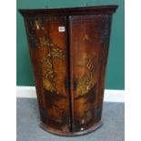 An 18th century Japanned bowfront hanging two door corner cupboard, 57cm wide x 93cm high.