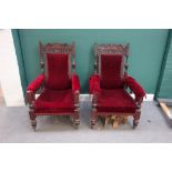 A pair of Victorian carved walnut open armchairs, on baluster reeded supports,