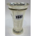 A silver beaker, of tapering cylindrical form,