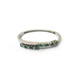 An emerald and diamond set oval hinged bangle,