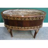 An 18th century style gilt metal mounted oval jardiniere/wine cooler, 88cm wide x 58cm high.