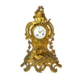A French gilt bronze mantel clock, late 19th century, with white enamel dial,