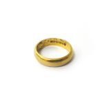 A 22ct gold plain wedding ring, London 1966, ring size K and a half, weight 5 gms.