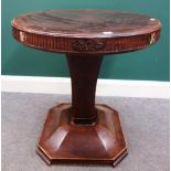 A 19th century North European circular mahogany centre table, on flared square column,