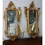A pair of 18th century Italian style giltwood girandole mirrors, with carved frames,