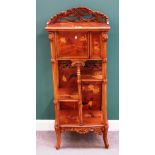 Probably Emile Galle; an early 20th century marquetry inlaid walnut etagere on scroll feet,