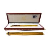 A Cartier 'Les Must de Cartier' gold plated ballpoint pen, cased, 13.