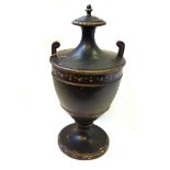An ebonised carved wooden urn, early 20th century,